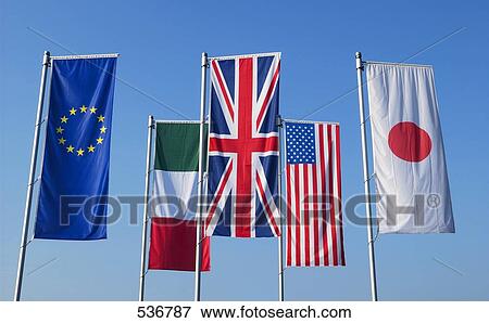 Flags of different countries against blue sky View Large Photo Image Stock Photo - Flags of different countries against blue sky . Fotosearch