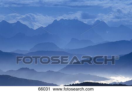 Fog over mountain range, Kampenwand, Chiemgau, Bavaria, Germany View Large Photo Image Stock Image - Fog over mountain range, Kampenwand, Chiemgau, Bavaria, Germany . Fotosearch