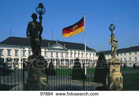 Picture - German flag in front of building, Berlin, Germany . Fotosearch