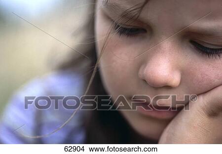 Picture - Girl looking sad, close-up . Fotosearch