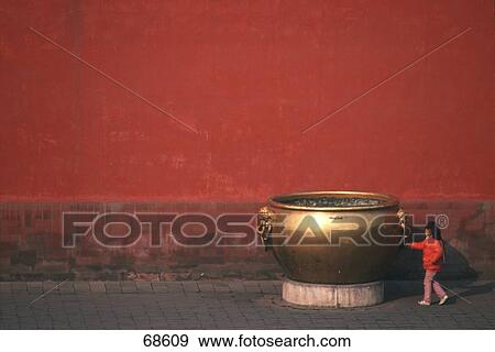 Girl touching giant boiler pot brass, Forbidden City, Beijing, China View Large Photo Image Stock Photo - Girl touching giant boiler pot brass, Forbidden City, Beijing, China . Fotosearch
