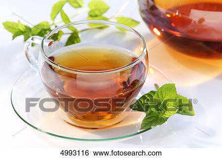 Glass of tea and mint leaf View Large Photo Image Stock Photograph - Glass of tea and mint leaf . Fotosearch