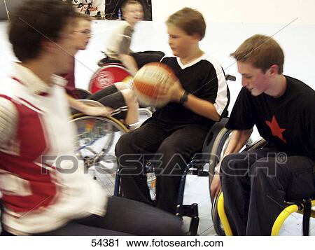 Handicapped teenage boys playing basketball View Large Photo Image Stock Image - Handicapped teenage boys playing basketball . Fotosearch