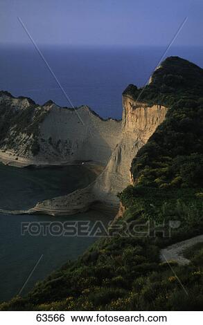 High angle view of cliff in sea, Cape Drastis, Corfu, Ionian Islands, Greece View Large Photo Image Stock Photograph - High angle view of cliff in sea, Cape Drastis, Corfu, Ionian Islands, Greece . Fotosearch