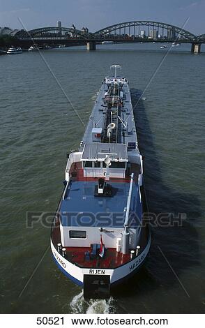 Stock Image - High angle view of container ship in river, Rhine River, Dusseldorf, Germany . Fotosearch