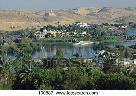 High angle view of hotel near river with mausoleum in background, Aswan, Egypt View Large Photo Image Stock Photo - High angle view of hotel near river with mausoleum in background, Aswan, Egypt . Fotosearch