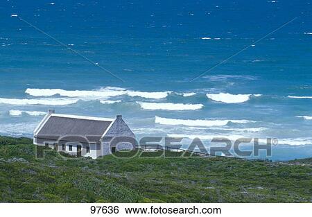 Stock Photograph - High angle view of house on coast . Fotosearch