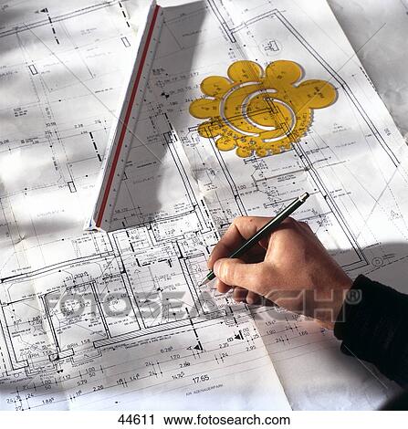 High angle view of man holding pen on blueprint View Large Photo Image Stock Image - High angle view of man holding pen on blueprint . Fotosearch