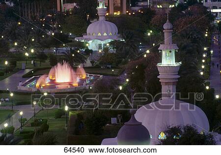 Stock Image - High angle view of mosque lit up at night, Abu Dhabi, United Arab Emirates . Fotosearch