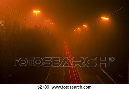 High angle view of traffic on road in foggy night View Large Photo Image Stock Photo - High angle view of traffic on road in foggy night . Fotosearch
