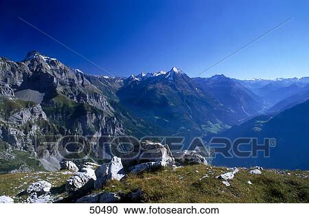 Stock Image - High angle view of valley in mountain range, Swiss Alps, Switzerland . Fotosearch