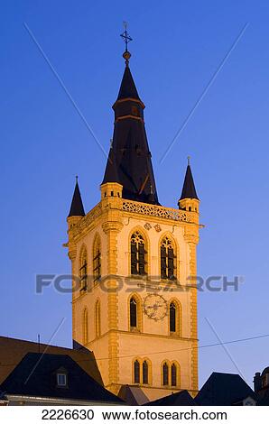 High section view of clock tower against sky, St. Gangolfkirche, Trier, Germany View Large Photo Image Stock Image - High section view of clock tower against sky, St. Gangolfkirche, Trier, Germany . Fotosearch