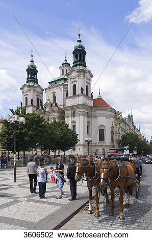 Stock Image - Horse-drawn carriage at the Nikolai Church, Prague, Czech Republic . Fotosearch