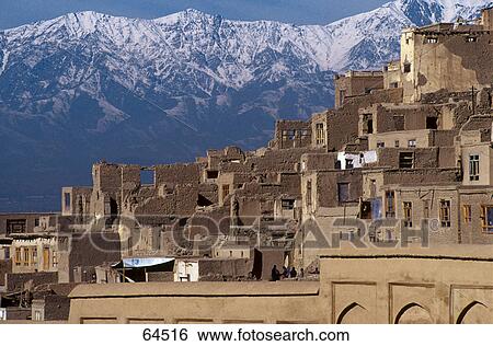 Stock Photograph - Houses in city against mountain range, Kabul, Afghanistan . Fotosearch