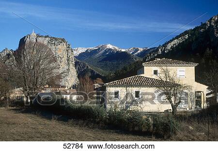 Houses with mountains in background, Castellane, Alpes-De-Haute-Provence, Provence-Alpes-Cote D'Azur, France View Large Photo Image Picture - Houses with mountains in background, Castellane, Alpes-De-Haute-Provence, Provence-Alpes-Cote D'Azur, France . Fotosearch