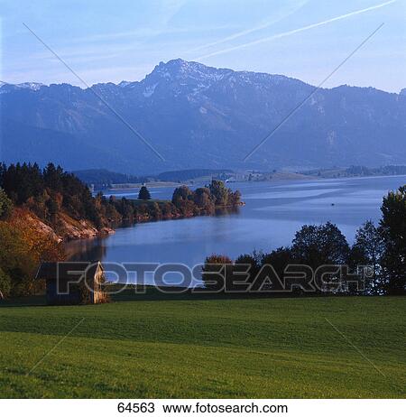 Hut at coast during dusk, Bavaria, Germany View Large Photo Image Stock Image - Hut at coast during dusk, Bavaria, Germany . Fotosearch