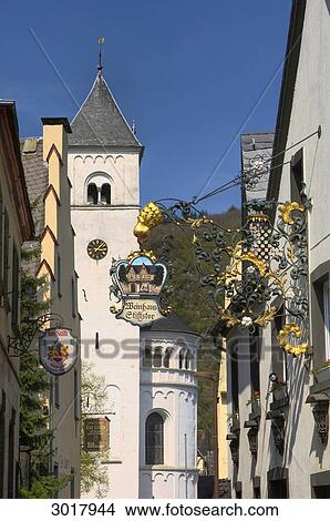 Inn sign in front of the St. Castor Abbey Church, Treis-Karden, Rhineland-Palatinate, Germany View Large Photo Image Picture - Inn sign in front of the St. Castor Abbey Church, Treis-Karden, Rhineland-Palatinate, Germany . Fotosearch