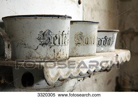 Stock Photography - Kitchen shelf with ancient buckets . Fotosearch