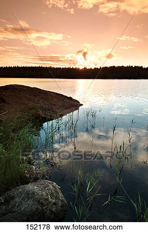 Lake at sunset, Mikkeli, Finland View Large Photo Image Stock Photo - Lake at sunset, Mikkeli, Finland . Fotosearch