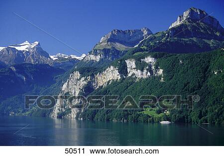 Stock Image - Lake in front of mountains, Lake Lucerne, Swiss Alps, Switzerland . Fotosearch