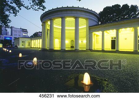 Stock Image - Lit up fountains in front building, Apache, Germany . Fotosearch