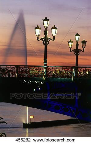 Lit up lampposts on bridge during dusk, Arch Bridge, Belgium View Large Photo Image Stock Image - Lit up lampposts on bridge during dusk, Arch Bridge, Belgium . Fotosearch