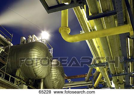 Stock Photo - Low angle view of chemical plant . Fotosearch