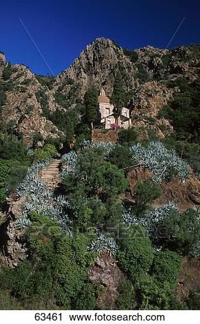 Stock Image - Low angle view of church on mountain, Elba Island, Tuscany, Italy . Fotosearch