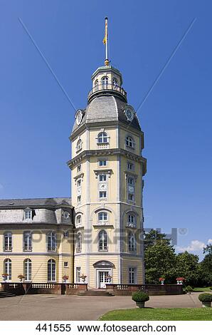 Stock Photography - Low angle view of clock tower against blue sky . Fotosearch