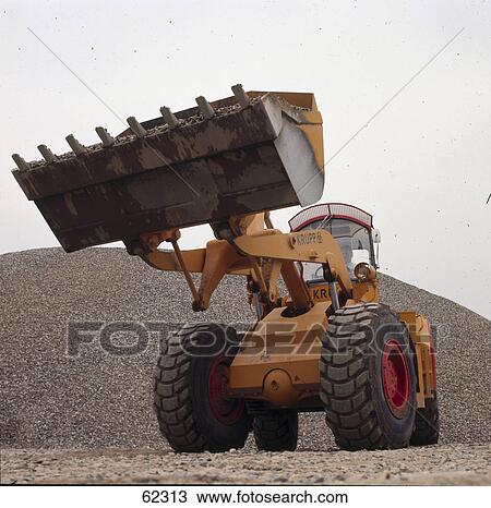 Stock Image - Low angle view of earth mover . Fotosearch
