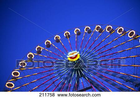 Low angle view of ferris wheel View Large Photo Image Stock Photo - Low angle view of ferris wheel . Fotosearch