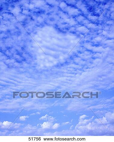 Low angle view of heart shape clouds in sky View Large Photo Image Stock Photograph - Low angle view of heart shape clouds in sky . Fotosearch