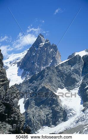 Stock Photograph - Low angle view of mountain, Swiss Alps, Switzerland . Fotosearch