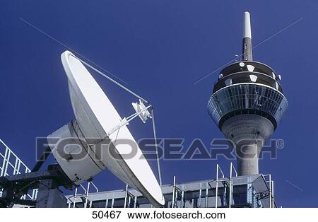 Low angle view of satellite dish and communication tower, Dusseldorf, Germany View Large Photo Image Stock Photo - Low angle view of satellite dish and communication tower, Dusseldorf, Germany . Fotosearch