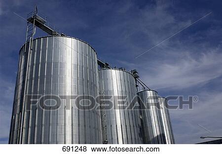 Stock Photo - Low angle view of silos . Fotosearch