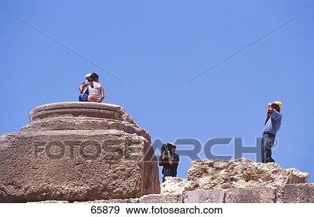 Low angle view of tourists photographing, Baalbek, Bekaa Valley, Lebanon View Large Photo Image Stock Photo - Low angle view of tourists photographing, Baalbek, Bekaa Valley, Lebanon . Fotosearch