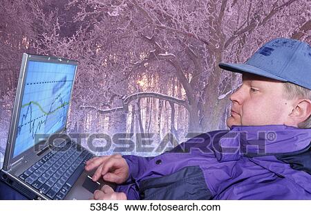 Stock Photography - Man using laptop . Fotosearch