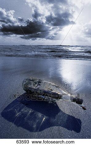 Message in a bottle on the beach View Large Photo Image Stock Image - Message in a bottle on the beach . Fotosearch