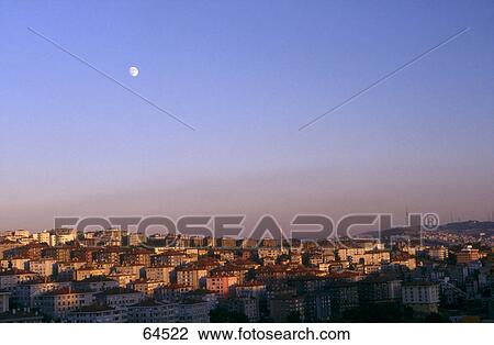 Stock Image - Moon over cityscape, Istanbul, Turkey . Fotosearch