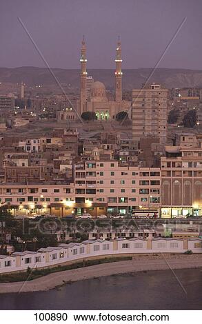 Mosque in city lit up at night, Aswan, Egypt View Large Photo Image Stock Image - Mosque in city lit up at night, Aswan, Egypt . Fotosearch