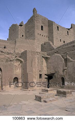 Stock Image - Old ruins of building under blue sky, Aswan, Egypt . Fotosearch