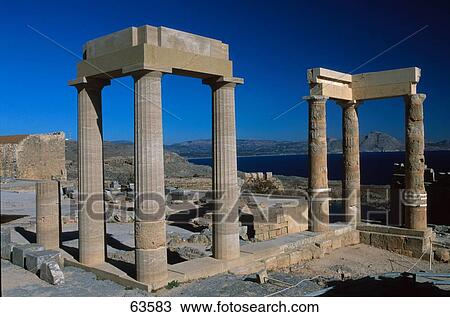 Stock Image - Old ruins of building under clear blue sky, Dodecanese Islands, Greece . Fotosearch