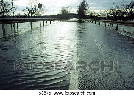 Stock Photography - Over flooded road in town, Germany . Fotosearch