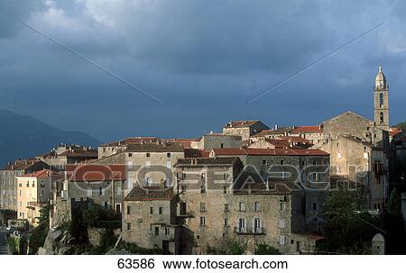Stock Photograph - Overcast sky above town, Sartene, Corsica, France . Fotosearch