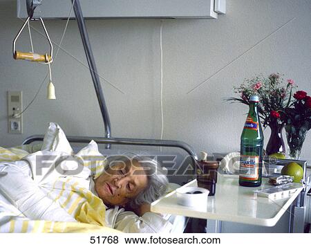 Patient lying on hospital bed View Large Photo Image Stock Photo - Patient lying on hospital bed . Fotosearch