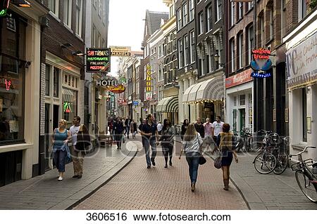 Pedestrians in the Warmoesstraat, Amsterdam, Netherlands View Large Photo Image Stock Photograph - Pedestrians in the Warmoesstraat, Amsterdam, Netherlands . Fotosearch