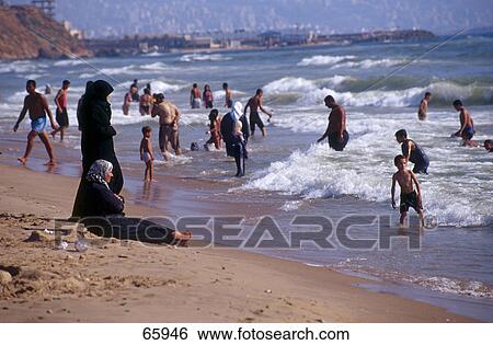 Stock Photograph - People at beach, Beirut, Lebanon . Fotosearch