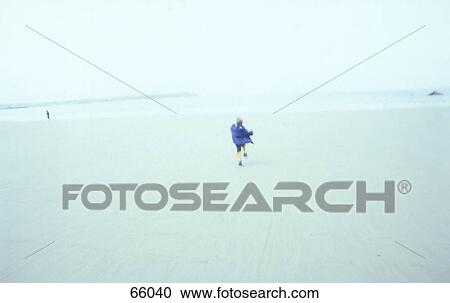 Person running on beach View Large Photo Image Stock Image - Person running on beach . Fotosearch