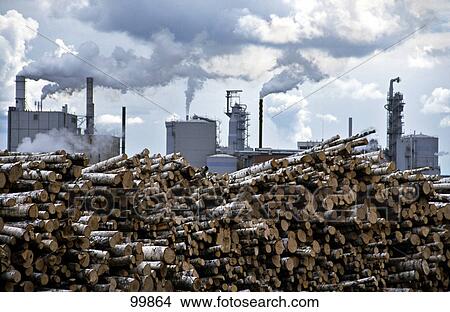Pile of logs in front of factory View Large Photo Image Picture - Pile of logs in front of factory . Fotosearch