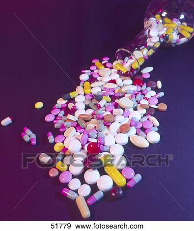 Pills spilling from bottle View Large Photo Image Stock Photo - Pills spilling from bottle . Fotosearch